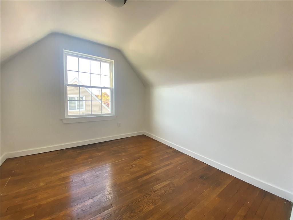 380 Vanadium Road Pittsburgh, PA 15243 - Photo 21 of 23 an empty room with wooden floor and windows