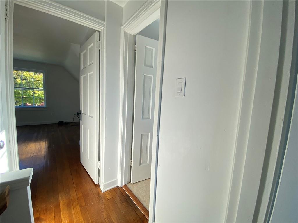 380 Vanadium Road Pittsburgh, PA 15243 - Photo 22 of 23 a view of a hallway with wooden floor and a room