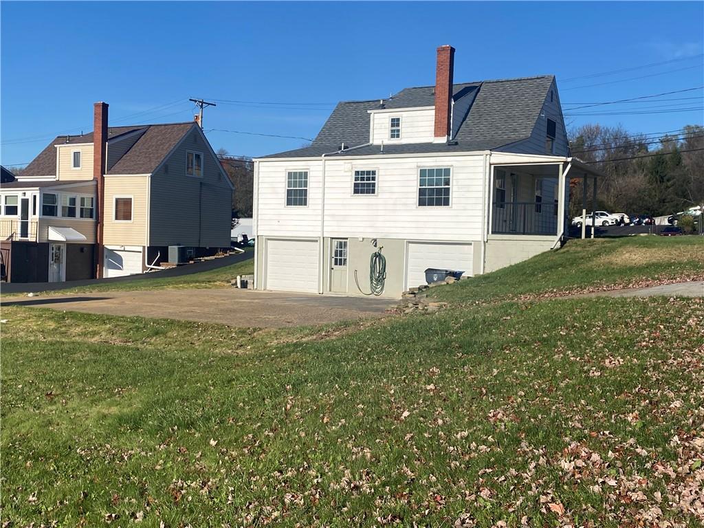 380 Vanadium Road Pittsburgh, PA 15243 - Photo 4 of 23 a view of a house with a back yard