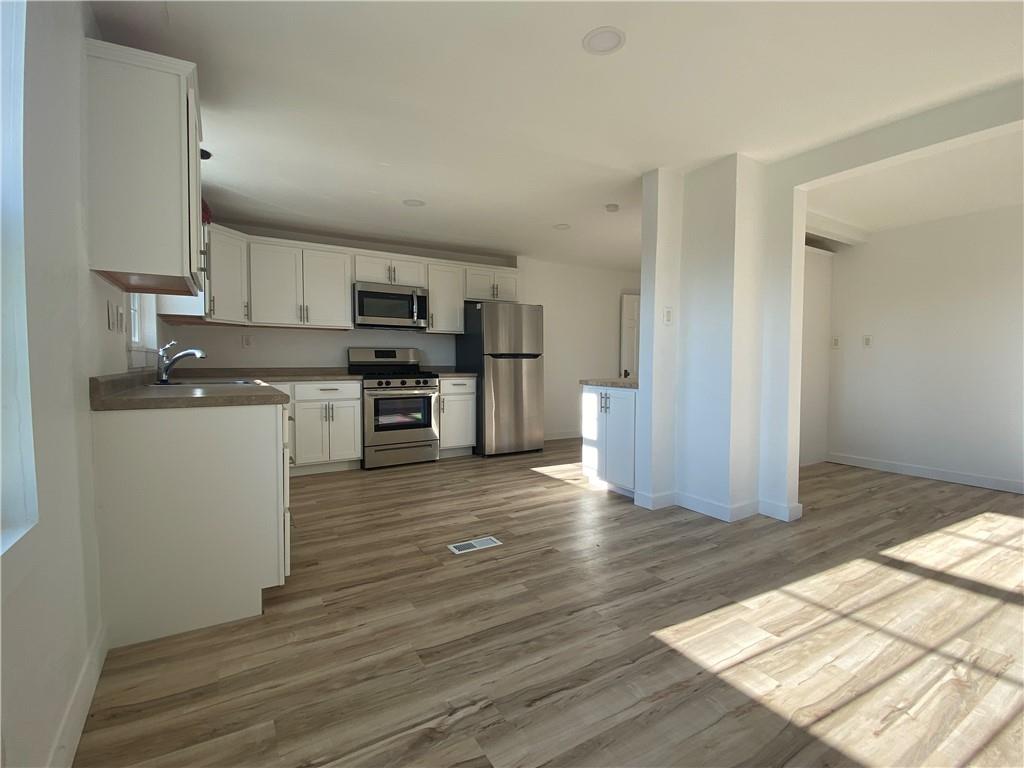380 Vanadium Road Pittsburgh, PA 15243 - Photo 8 of 23 a view of kitchen with wooden floor