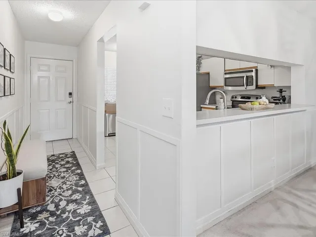 a kitchen with a refrigerator stove and microwave