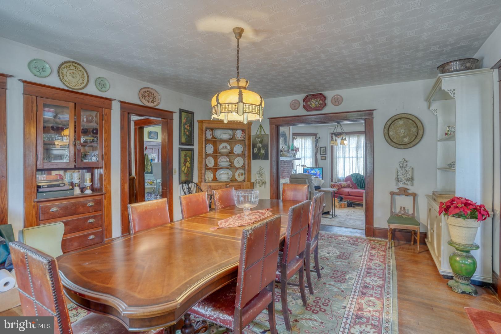 4096 Main Street Trappe, MD 21673 - Photo 27 of 70 a dining room with furniture a clock and a large window