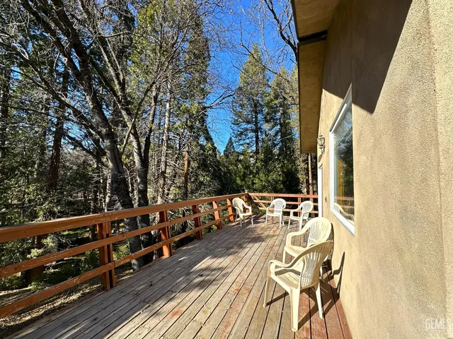 a view of outdoor dining space with furniture and garden