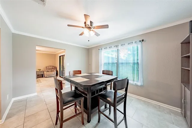 a dining room with furniture and window