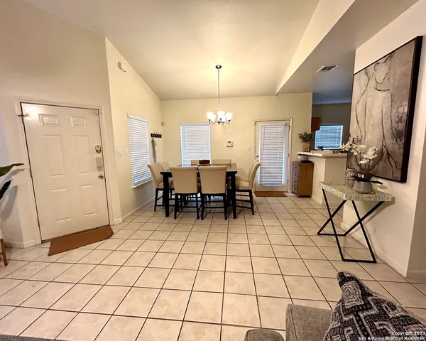 a view of a livingroom with furniture and workspace