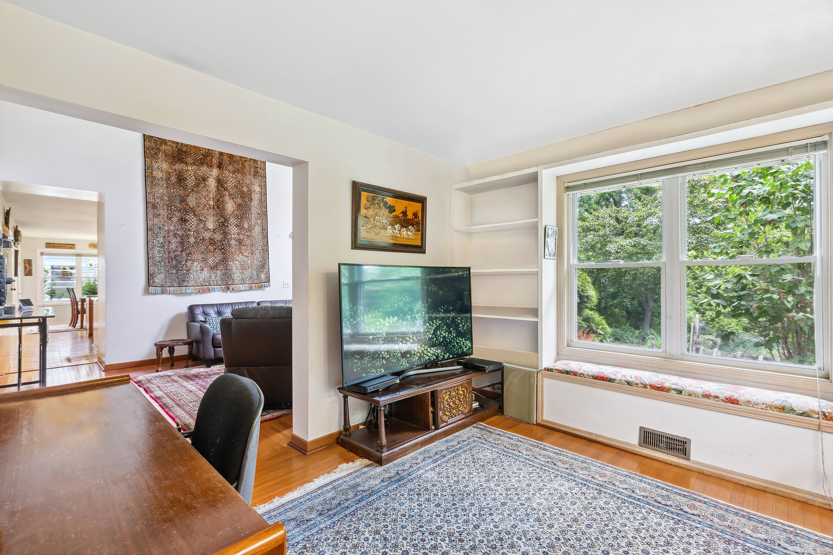 497 Farm Bridge Road Lake Zurich, IL 60047 - Photo 11 of 27 a living room with furniture and a flat screen tv