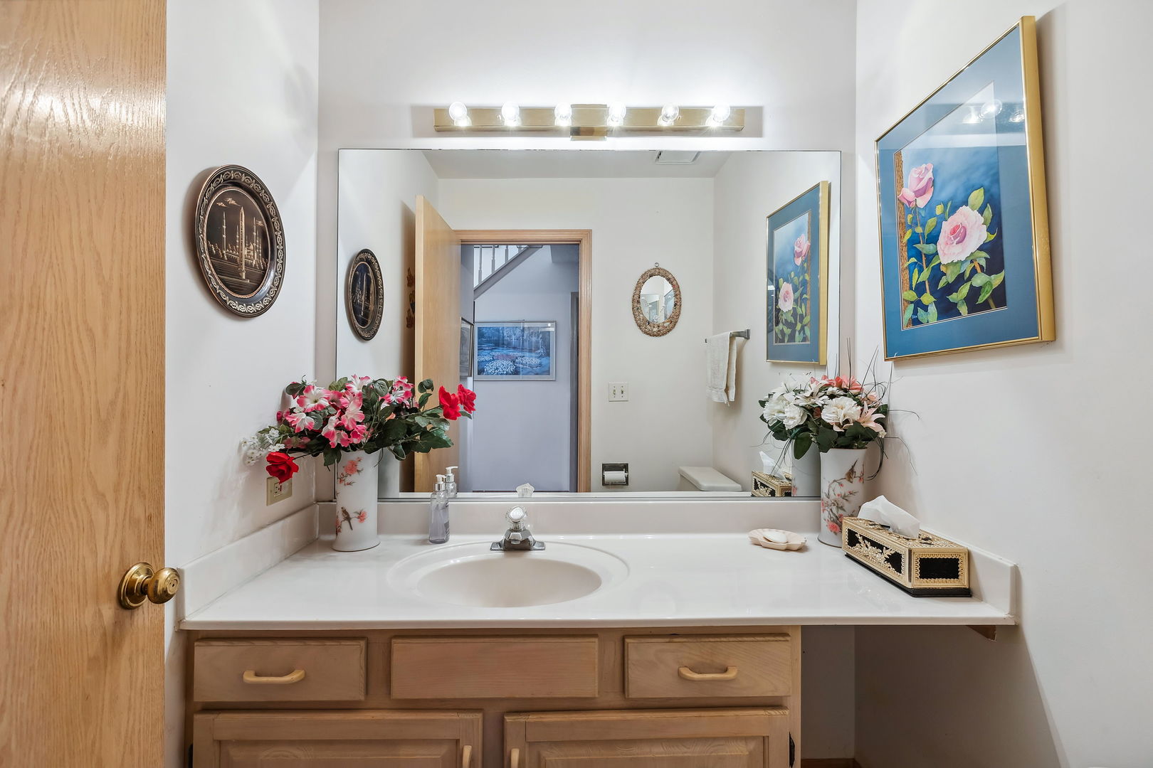 497 Farm Bridge Road Lake Zurich, IL 60047 - Photo 12 of 27 a bathroom with a sink and a mirror