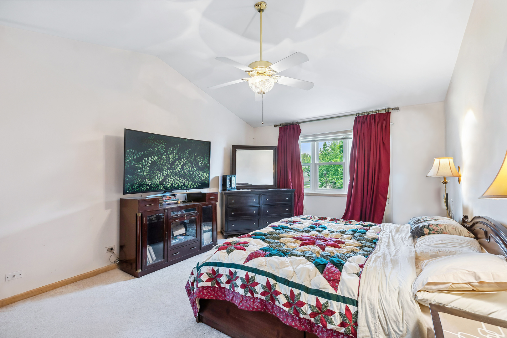 497 Farm Bridge Road Lake Zurich, IL 60047 - Photo 13 of 27 a bedroom with a bed and a chandelier