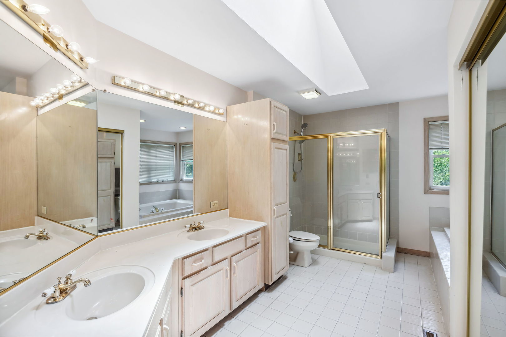 497 Farm Bridge Road Lake Zurich, IL 60047 - Photo 14 of 27 a bathroom with a double vanity sink mirror and shower