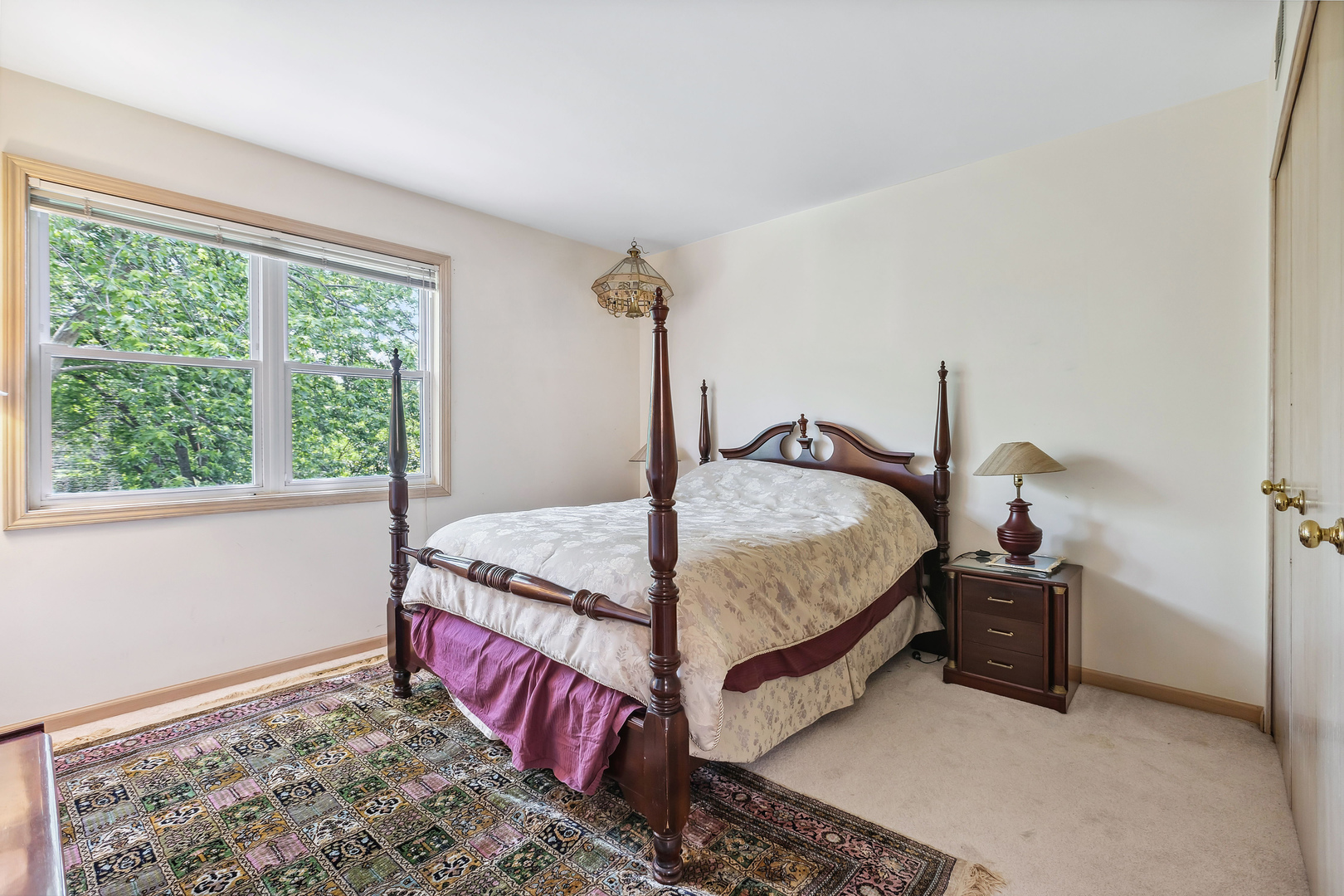 497 Farm Bridge Road Lake Zurich, IL 60047 - Photo 17 of 27 a bed sitting in a bedroom next to a window