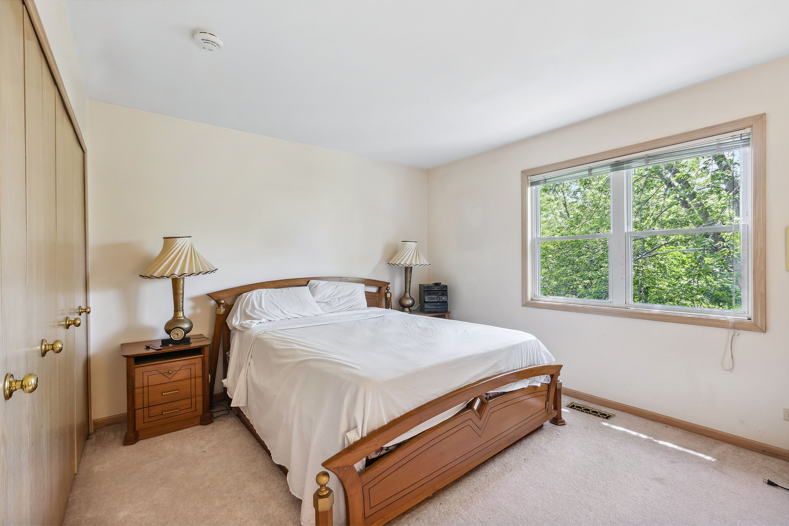 497 Farm Bridge Road Lake Zurich, IL 60047 - Photo 18 of 27 a bed sitting in a bedroom next to a window