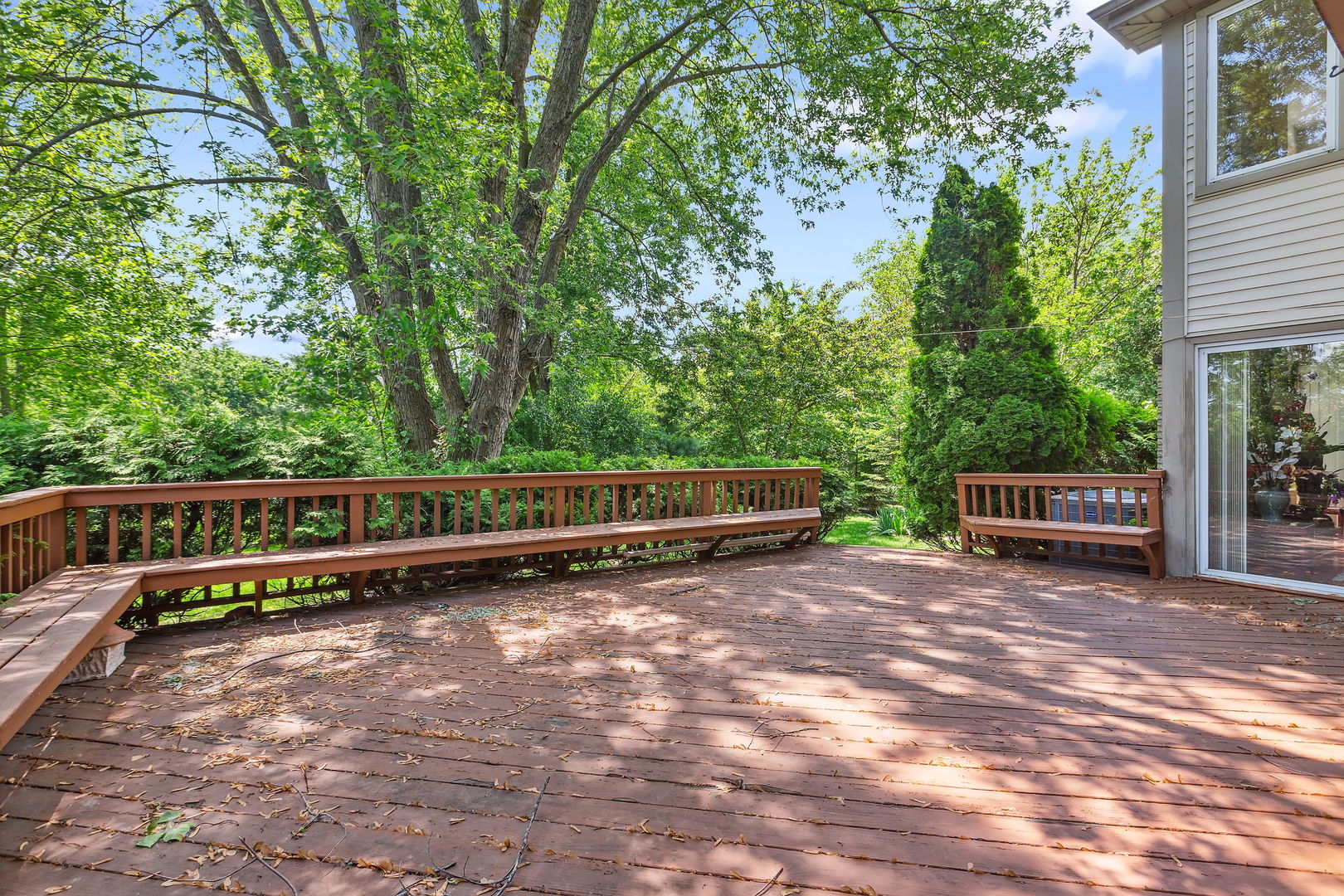 497 Farm Bridge Road Lake Zurich, IL 60047 - Photo 22 of 27 a view of a wooden deck with two chairs and a yard