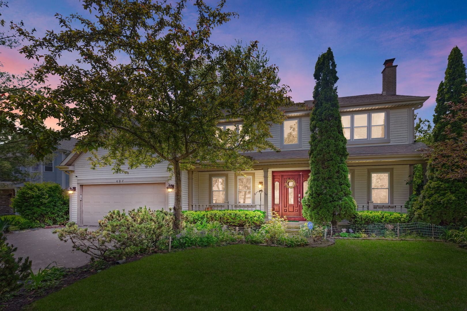 497 Farm Bridge Road Lake Zurich, IL 60047 - Photo 23 of 27 a front view of a house with a garden and yard