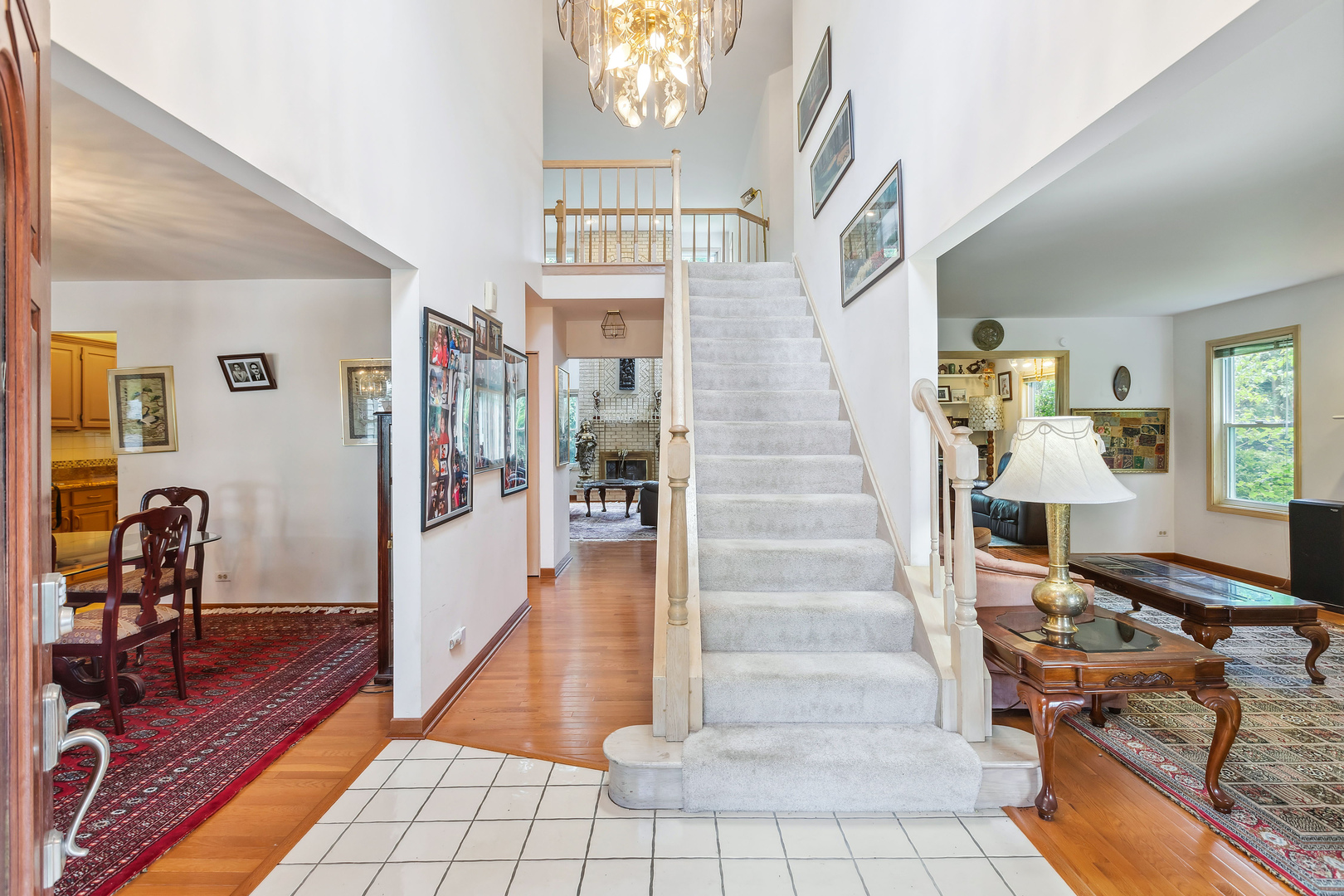 497 Farm Bridge Road Lake Zurich, IL 60047 - Photo 3 of 27 a view of a livingroom with furniture and stairs