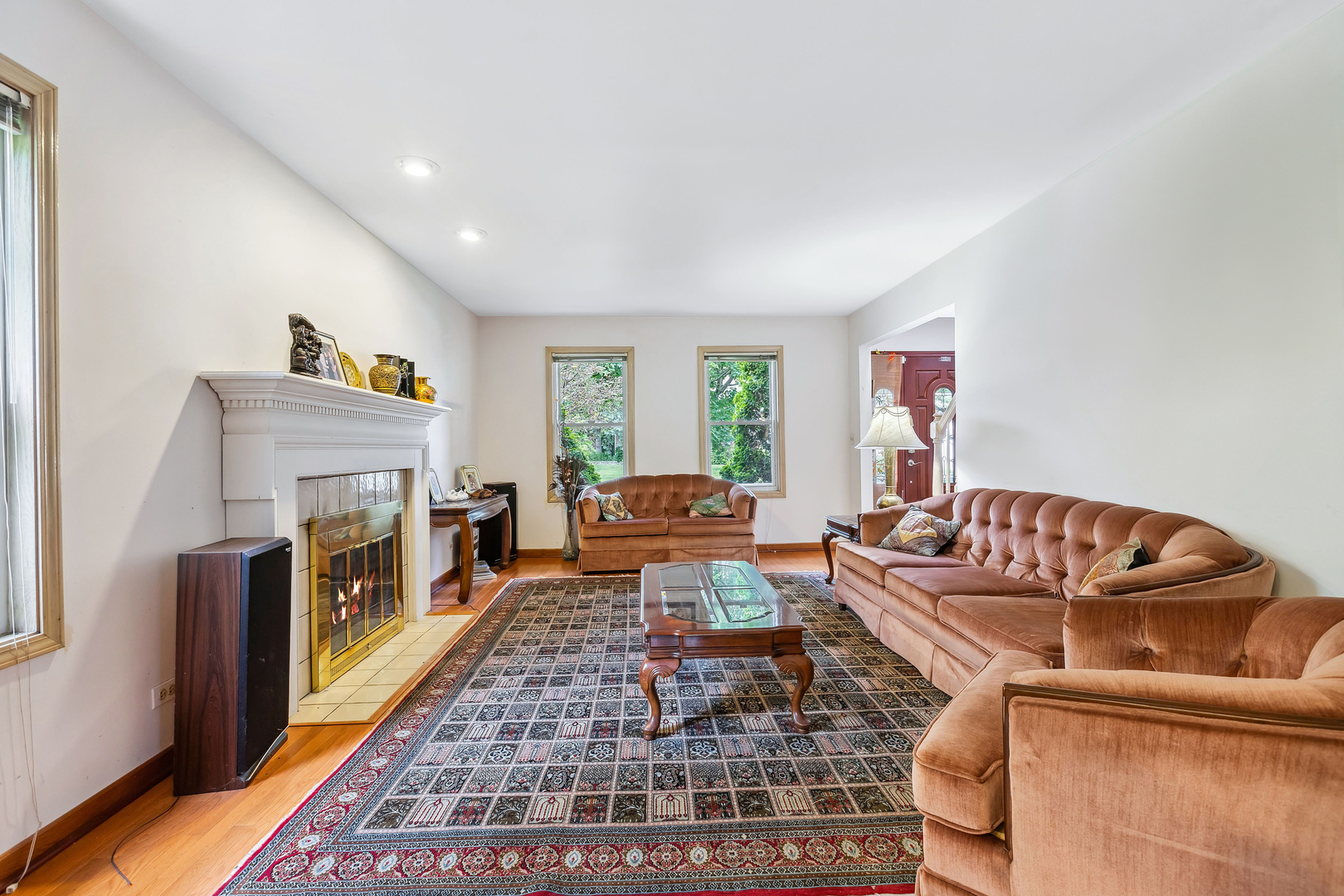 497 Farm Bridge Road Lake Zurich, IL 60047 - Photo 4 of 27 a living room with furniture and a fireplace