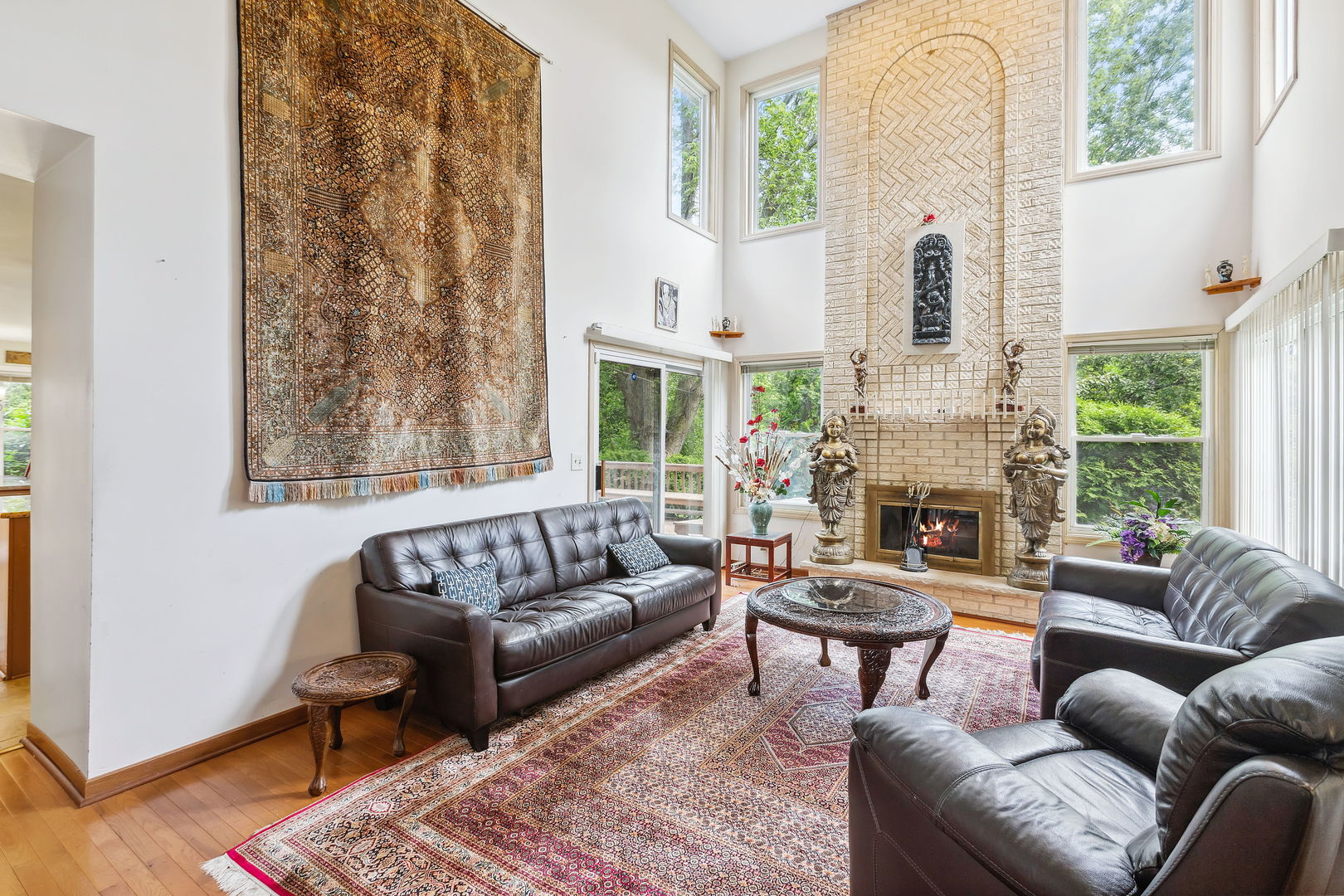 497 Farm Bridge Road Lake Zurich, IL 60047 - Photo 6 of 27 a living room with furniture a fireplace and a large window