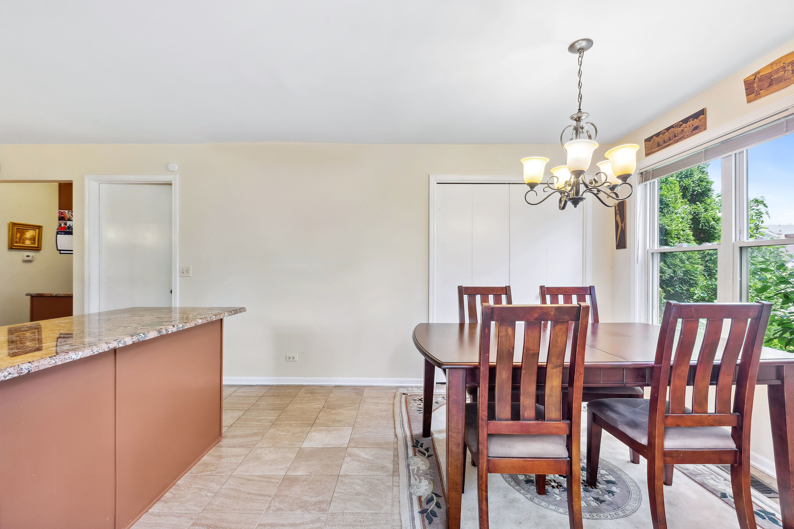 497 Farm Bridge Road Lake Zurich, IL 60047 - Photo 10 of 27 a dining room with furniture a chandelier and window