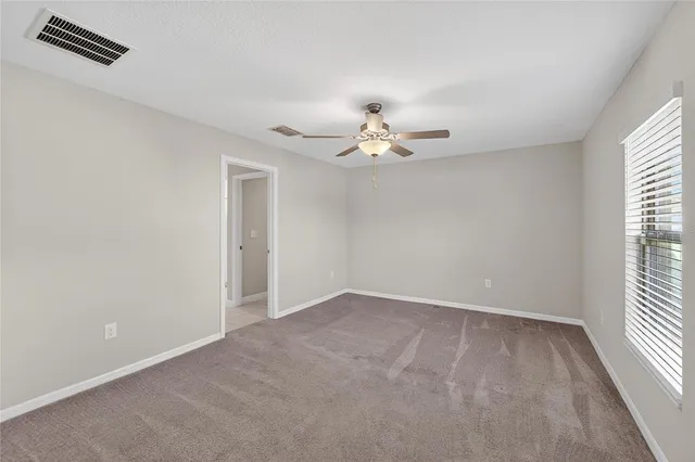 a bathroom with a granite countertop sink a mirror and a vanity