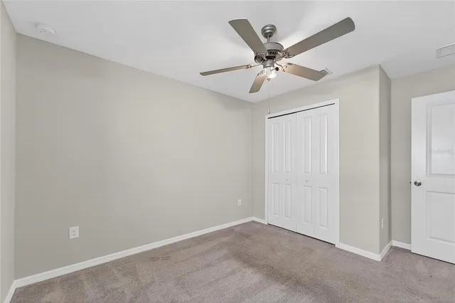 a white toilet and tub sitting next to a bathroom sink