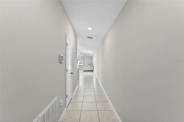 a kitchen with kitchen island granite countertop a sink a counter top space and cabinets