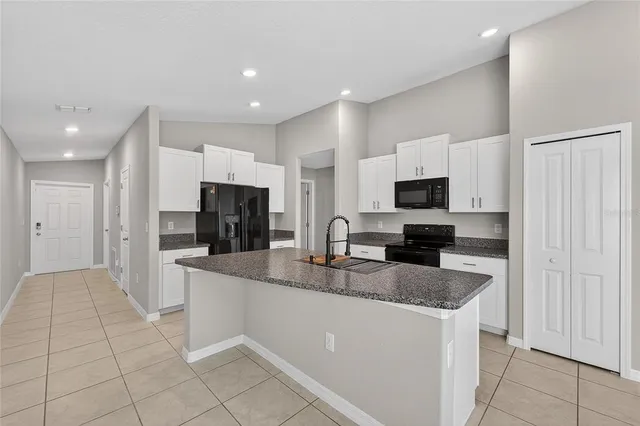 a view of living room with furniture and a couch