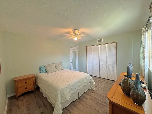 a bedroom with a bed and a dresser