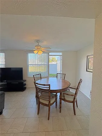 a view of a livingroom with furniture and window