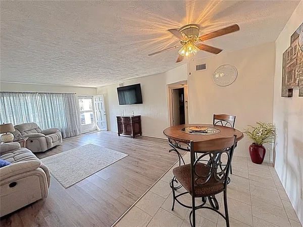 a living room with furniture and a table