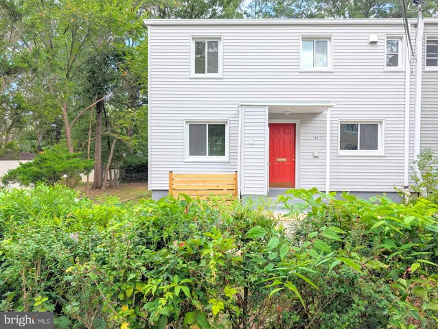 a front view of a house with yard