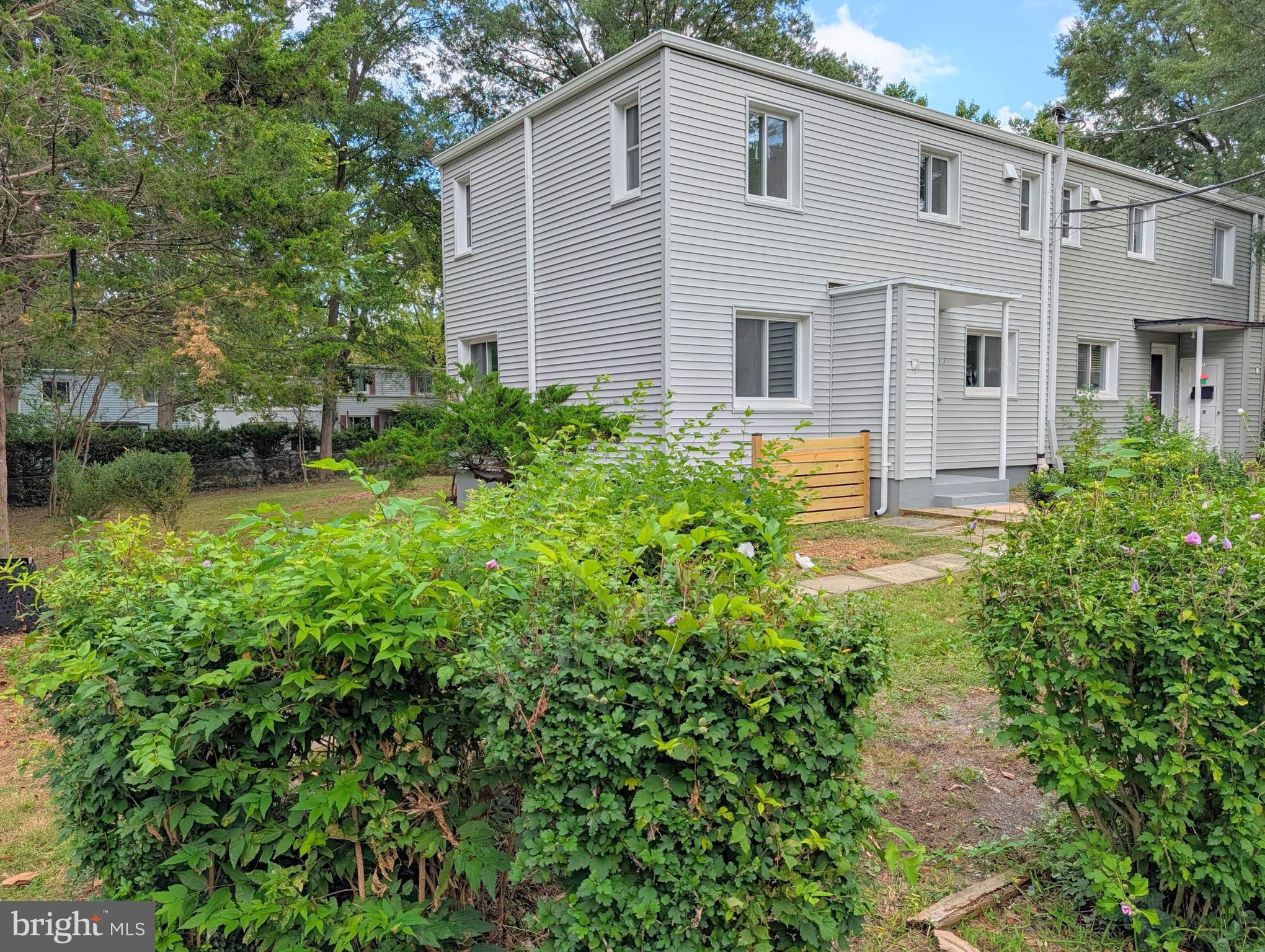 21 Ridge Road Greenbelt, MD 20770 - Photo 2 of 13 a front view of a house with garden