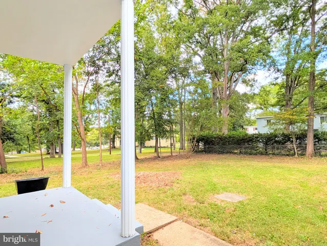 a view of swimming pool with an outdoor seating