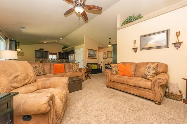 a large open kitchen with a large window and stainless steel appliances