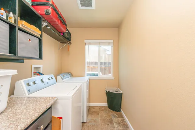 a bedroom with a large bed and a book shelf