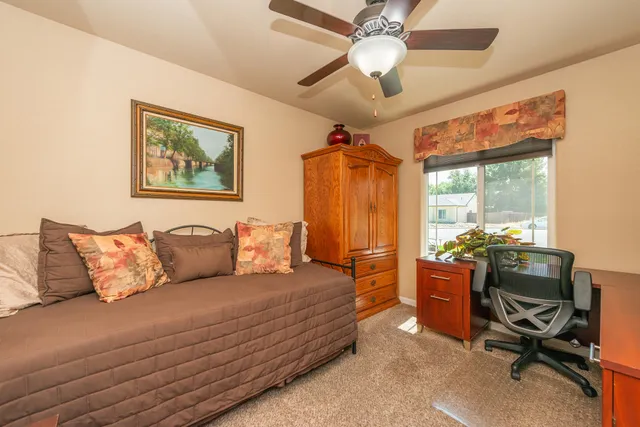 a bedroom with a bed and a dresser