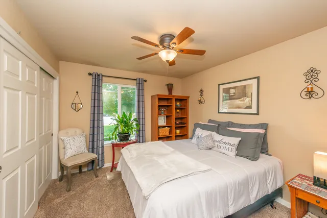 a view of walk in closet with clothes