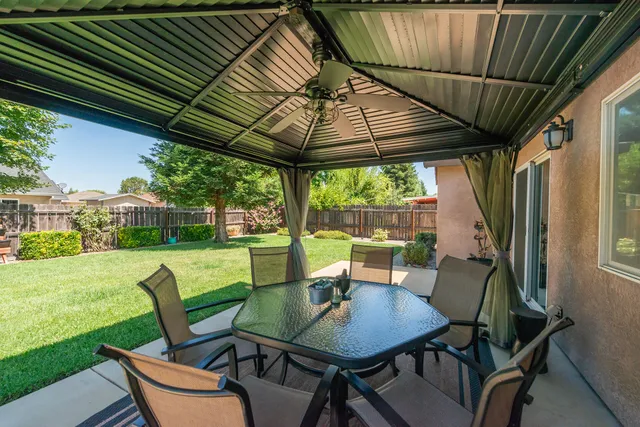 an aerial view of a house with yard