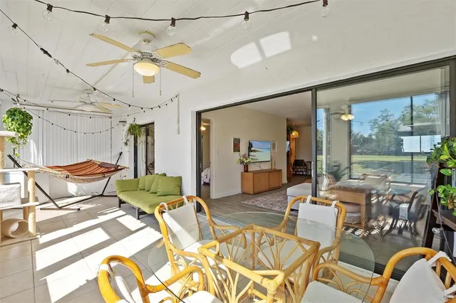 a living room with lots of furniture and a chandelier