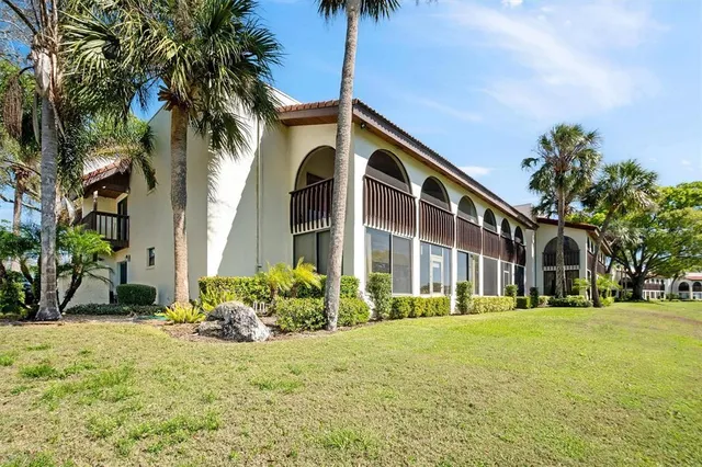 a view of a building with a yard