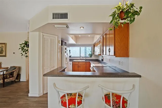 a bathroom with a sink a vanity and a large mirror
