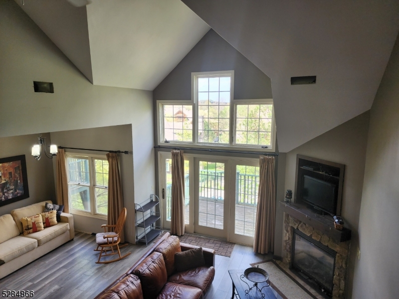 1 Pine Crescent, Unit 23 Vernon, NJ 07462 - Photo 13 of 28 a living room with furniture and a flat screen tv