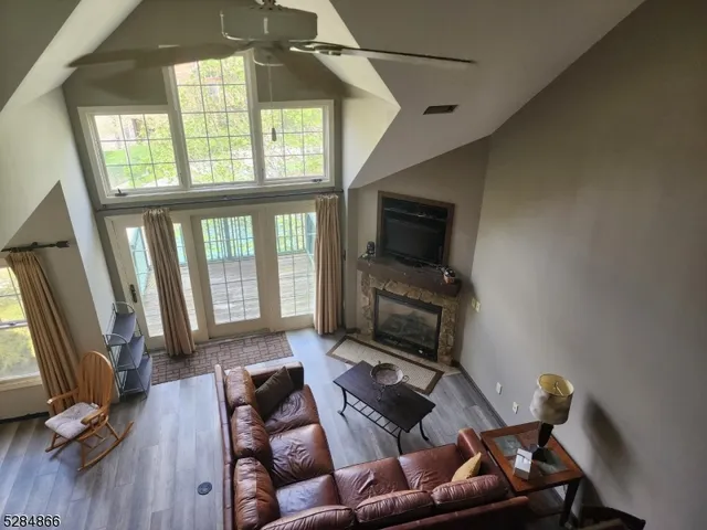 a living room with furniture fireplace and a flat screen tv