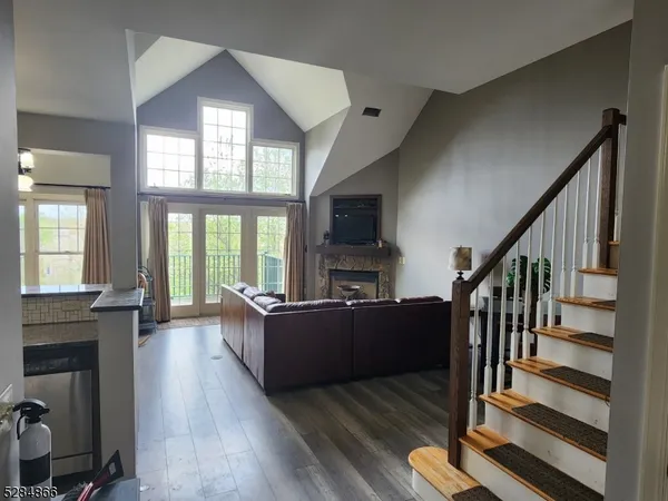 a living room with furniture fireplace and flat screen tv