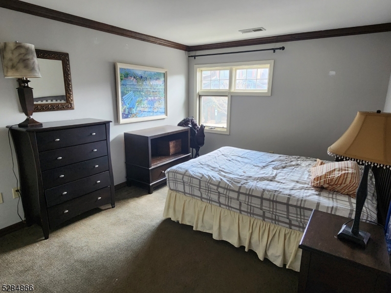 1 Pine Crescent, Unit 23 Vernon, NJ 07462 - Photo 26 of 28 a bedroom with a bed and a window