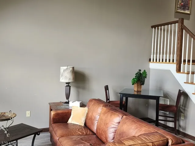 a bedroom with a bed and a lamp