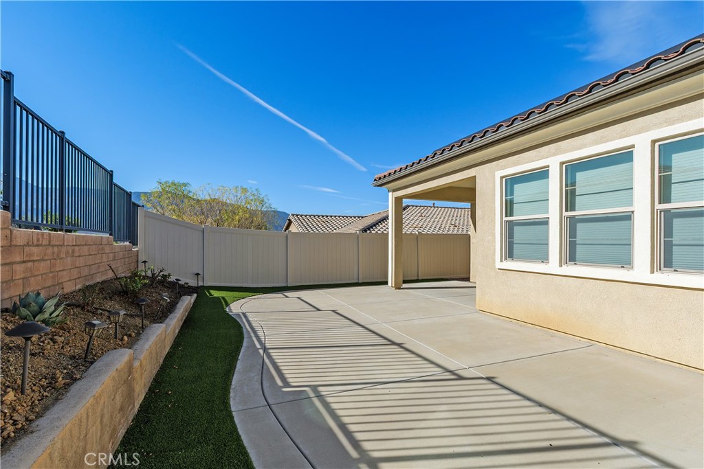 11169 Fourleaf Court Temescal Valley, CA 92883 - Photo 16 of 32 a view of a backyard of the house