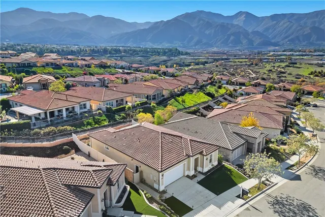 an aerial view of residential house and an outdoor space