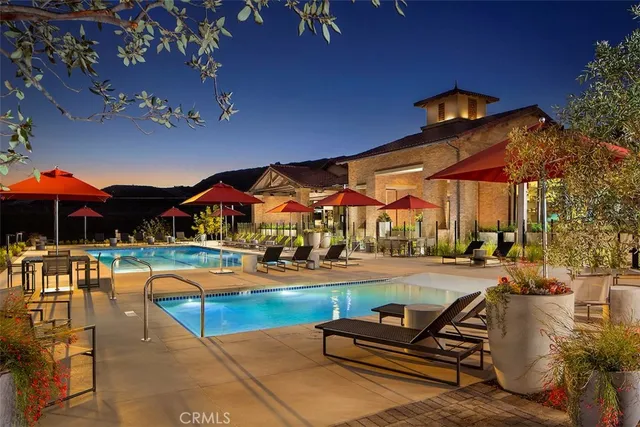 a outdoor space with patio lots of furniture and umbrella