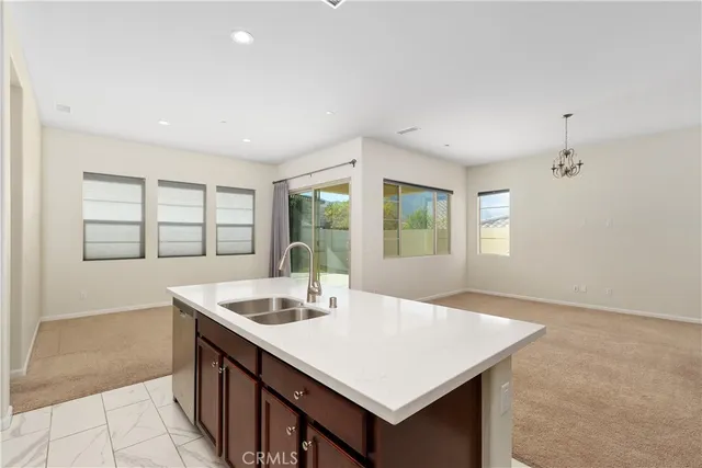 a kitchen with a sink cabinets and window