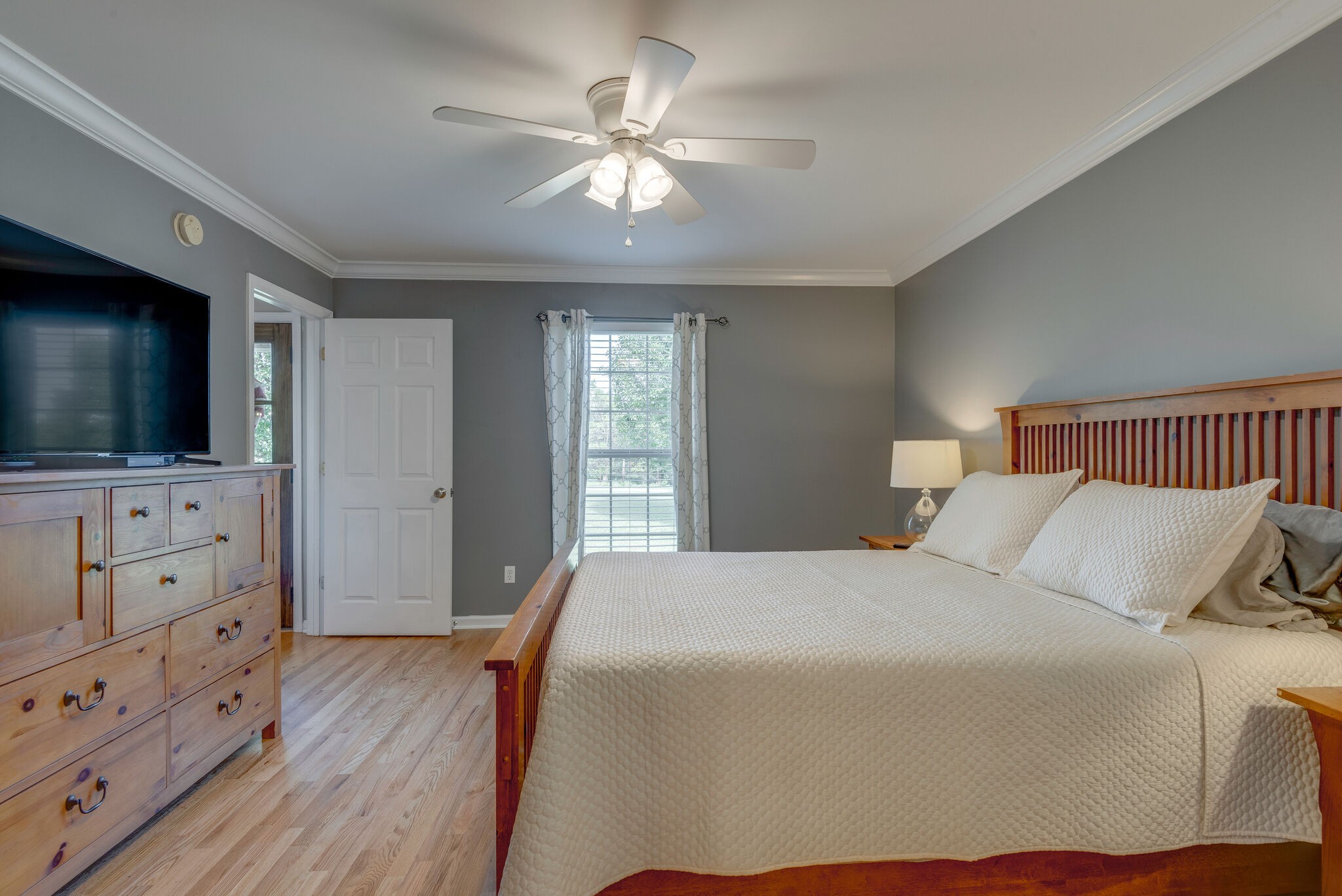 994 Hoover Road Burns, TN 37029 - Photo 17 of 28 a bedroom with a bed and a flat screen tv