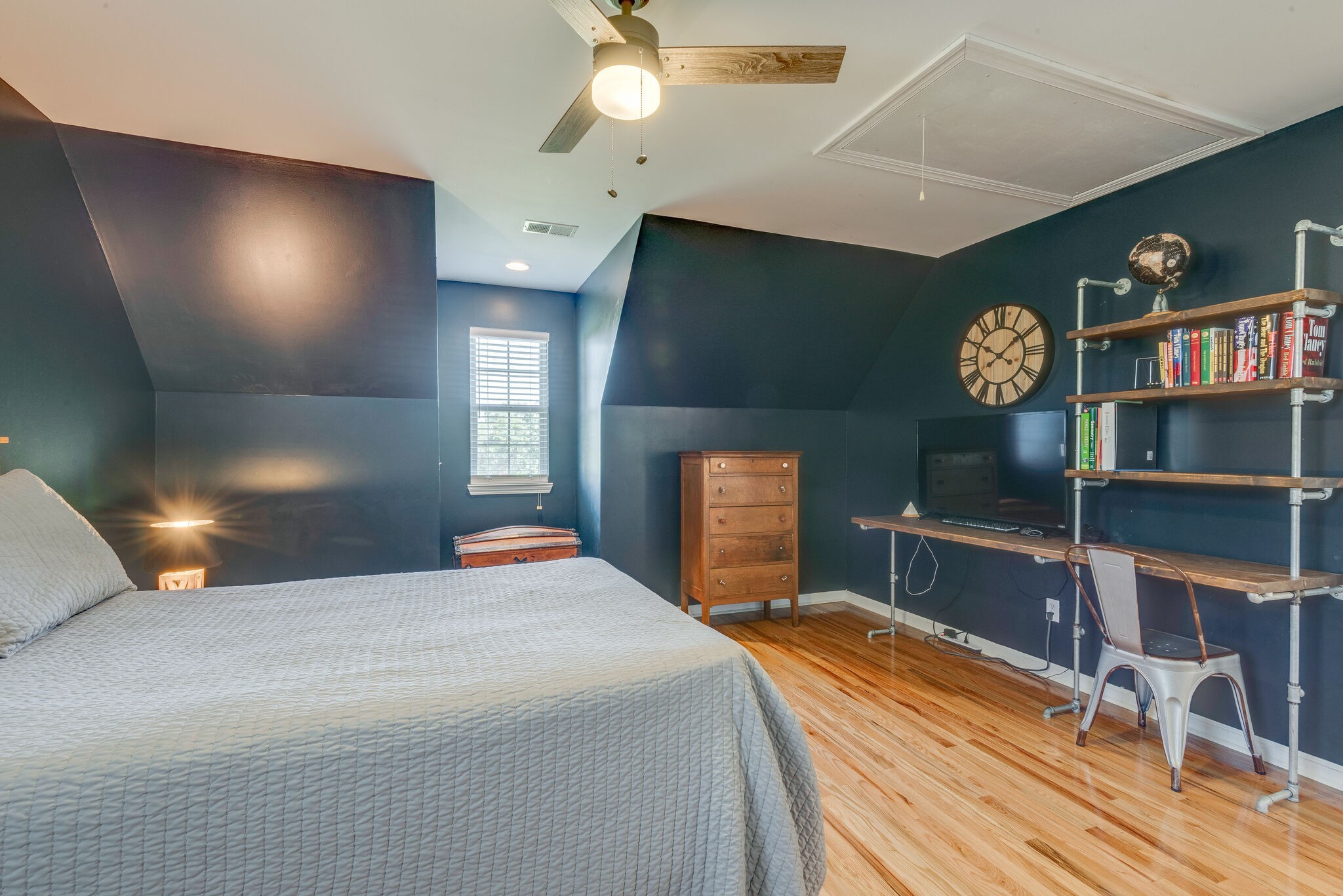 994 Hoover Road Burns, TN 37029 - Photo 21 of 28 a bedroom with a bed and a chandelier